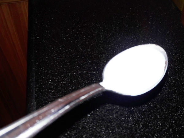 milk in spoon milk in spoon