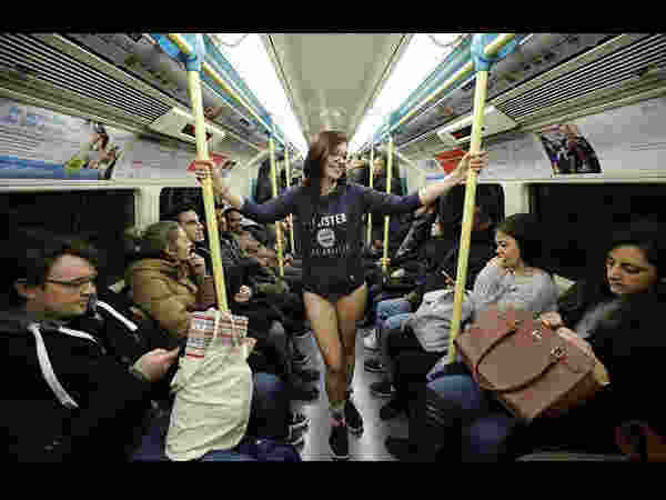man and women walk in underwear in metro on no pants day man and women walk in underwear in metro on no pants day