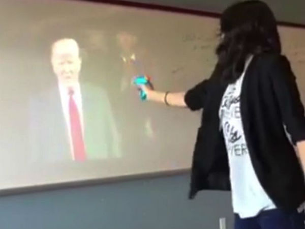 Teacher suspended over bizarre video of her 'shooting' President Trump and shouting 'die' in classroom Teacher suspended over bizarre video of her 'shooting' President Trump and shouting 'die' in classroom