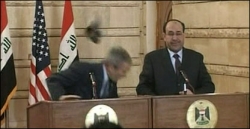 Iraqi journalist throws shoes at Bush Iraqi journalist throws shoes at Bush
