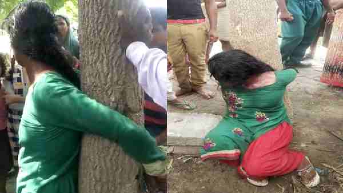 A woman was tied to a tree and was thrashed on the suspicion of child-theft A woman was tied to a tree and was thrashed on the suspicion of child-theft