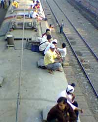 People on train roof People on train roof