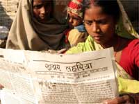 Woman reading Khabar Lahariya Woman reading Khabar Lahariya