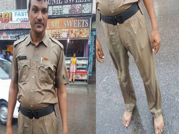 policeman doing duty without shoes in rain policeman doing duty without shoes in rain