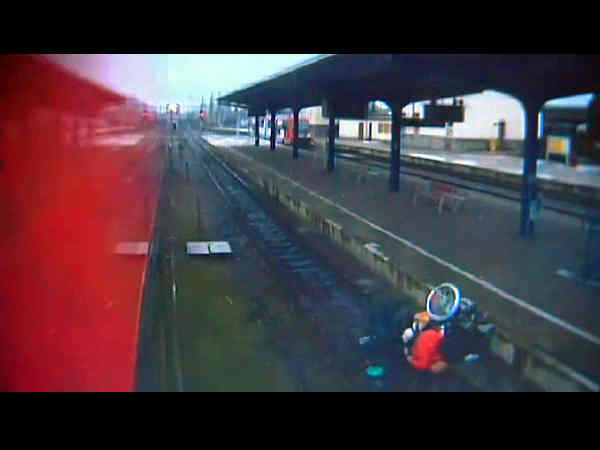 man shoves a wheelchair-bound elderly woman onto a train track before battering her head with a large rock man shoves a wheelchair-bound elderly woman onto a train track before battering her head with a large rock