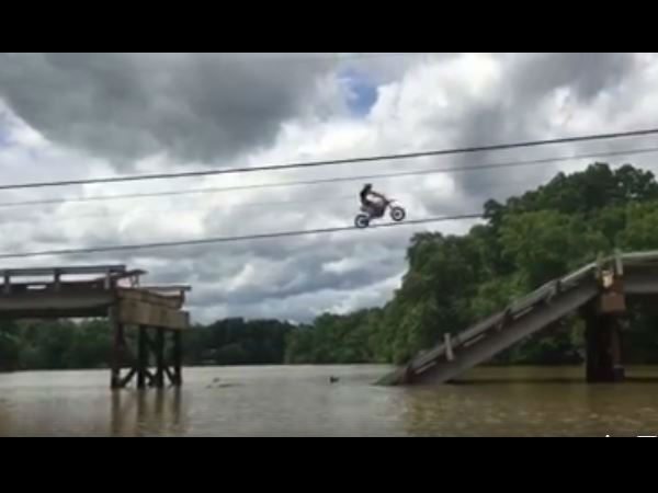 Video: Reckless bikers make dangerous jump over partially broken bridge Video: Reckless bikers make dangerous jump over partially broken bridge