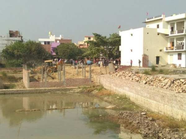 Bulldozer on govt land captured by Gayatri Prajapati Bulldozer on govt land captured by Gayatri Prajapati