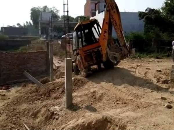 Bulldozer on govt land captured by Gayatri Prajapati Bulldozer on govt land captured by Gayatri Prajapati