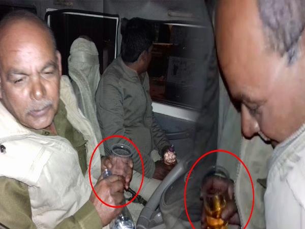 bulandshahr two policeman caught consuming liquor in dial 100 vehicle in NH bulandshahr two policeman caught consuming liquor in dial 100 vehicle in NH