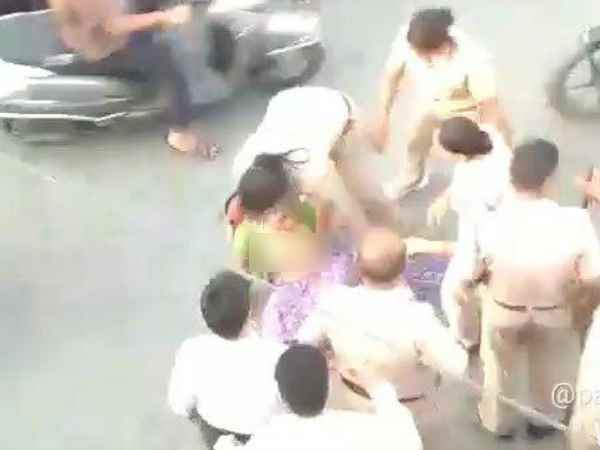 Women police beat elderly woman Women police beat elderly woman
