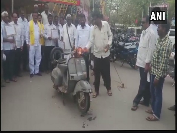AndhraPradesh: TDP worker set his own two-wheeler in protest against fuel price-hike AndhraPradesh: TDP worker set his own two-wheeler in protest against fuel price-hike