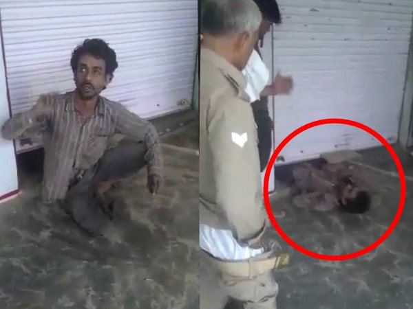 Thieves came to steal liquor one caught under the shutter of shop and his friend ran away Thieves came to steal liquor one caught under the shutter of shop and his friend ran away