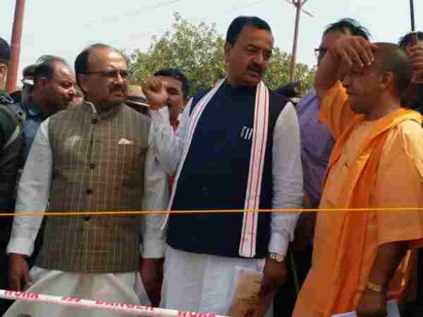 CM Yogi Adityanath suffers in heat of sun in Allahabad CM Yogi Adityanath suffers in heat of sun in Allahabad