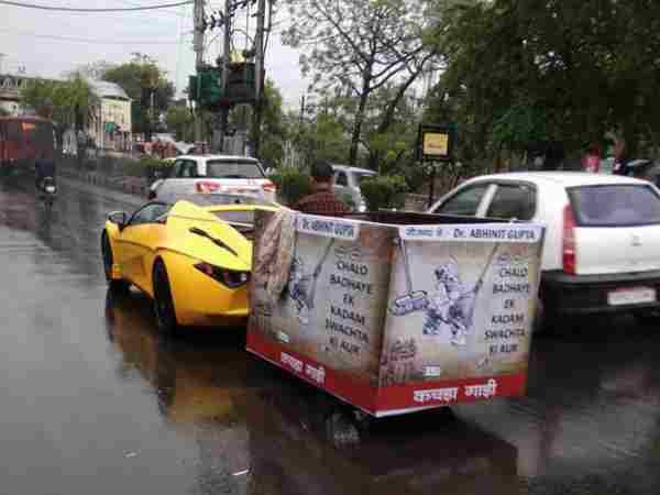 A man using his 70 lakhs car for dumping garbage A man using his 70 lakhs car for dumping garbage