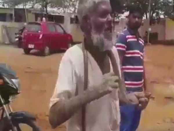 An old man went to office with cobra for getting pension in Karnataka An old man went to office with cobra for getting pension in Karnataka