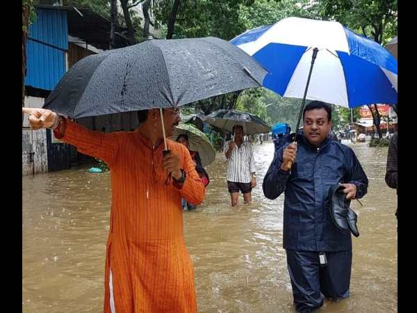 Mumbai Rains Sambit Patra and Keshav Upadhy wading through water while they were going to office Mumbai Rains Sambit Patra and Keshav Upadhy wading through water while they were going to office