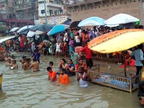 Devotees in Varanasi take holy dip in Ganga river after Devotees in Varanasi take holy dip in Ganga river after