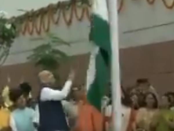 Congress attacks Amit Shah for dropping National Flag in bjp office Congress attacks Amit Shah for dropping National Flag in bjp office