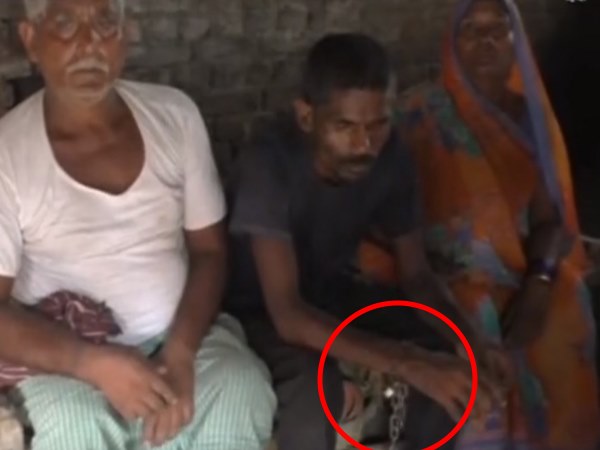 parents ties his son with iron chain as he is mental patient parents ties his son with iron chain as he is mental patient