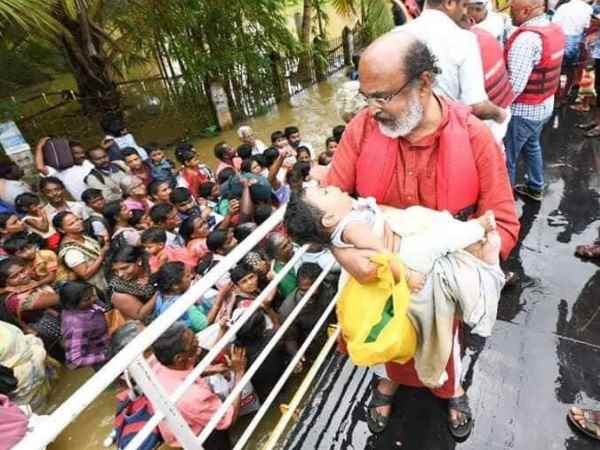 वित्त मंत्री थॉमस इसाक बच्चे के साथ