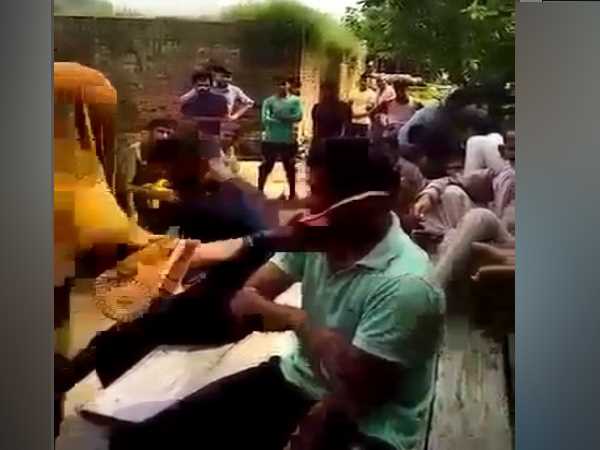 soilder wife beat two boys with slippers in front of panchayat soilder wife beat two boys with slippers in front of panchayat