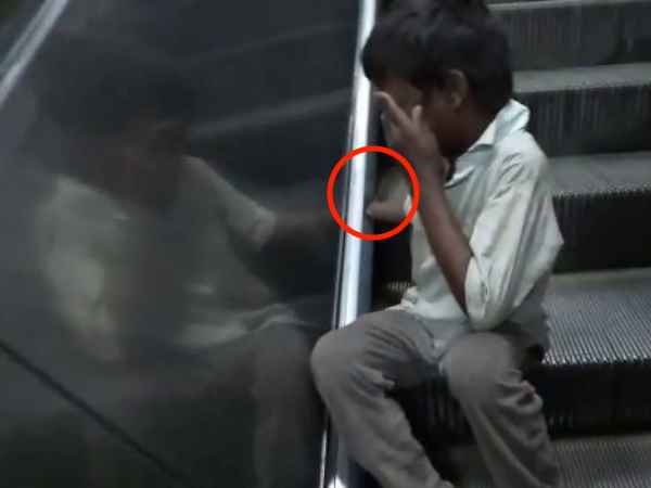 Agra: Childrens hand in the railway escalator Agra: Childrens hand in the railway escalator