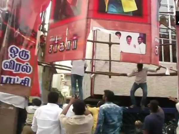 AIADMK workers vandalise posters of Sarkar movie outside Kasi theatre in Chennai AIADMK workers vandalise posters of Sarkar movie outside Kasi theatre in Chennai