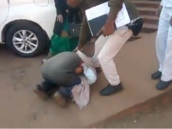 madhya pradesh farmer touches dm feet for power connection in shivpuri, video viral madhya pradesh farmer touches dm feet for power connection in shivpuri, video viral