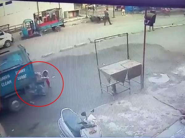 Vehicle passed over a woman in Surat and she saved see video Vehicle passed over a woman in Surat and she saved see video