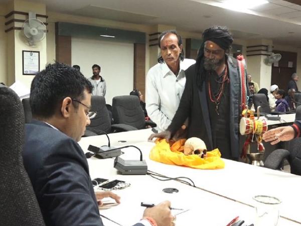 Tantrik Ramdas puts human skeleton on Table of Indore Collector Tantrik Ramdas puts human skeleton on Table of Indore Collector