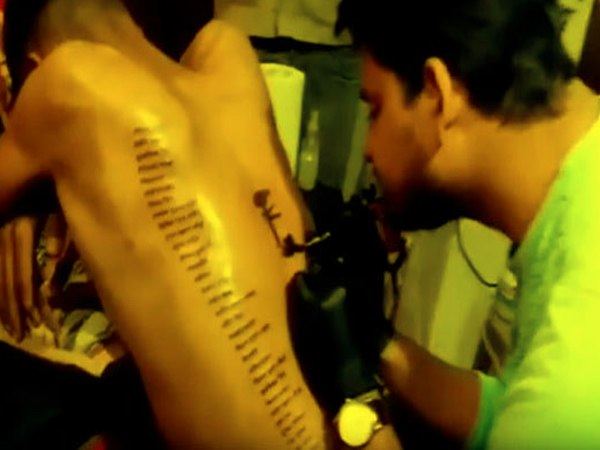 man gave tribute to martyrs by making tattoo or their names in body man gave tribute to martyrs by making tattoo or their names in body
