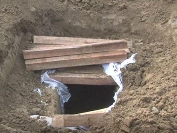 woman dead body digged out from grave in greater noida woman dead body digged out from grave in greater noida