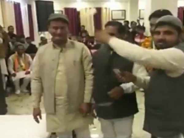 Congress party workers shower currency notes on Congress leader Virendra Rawat Congress party workers shower currency notes on Congress leader Virendra Rawat