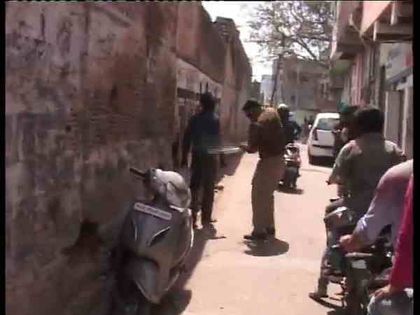 A youth beaten by policeman on holi A youth beaten by policeman on holi