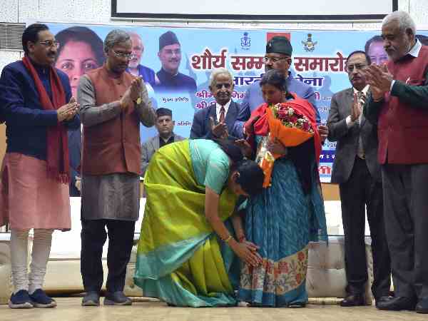 defence minister nirmala sitaramn touches feet of the martyrs family defence minister nirmala sitaramn touches feet of the martyrs family