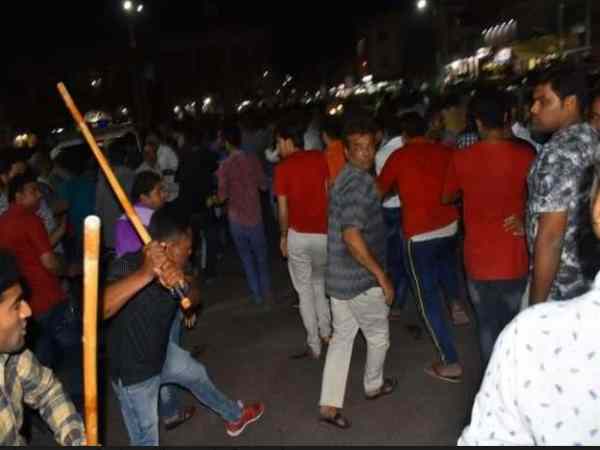 fight between police and traders at jamnagar, many injured fight between police and traders at jamnagar, many injured