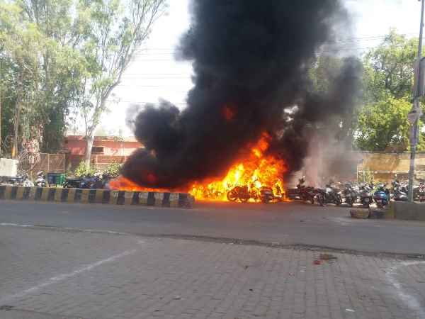 30 bikes torched in fire outside EVM distribution centre 30 bikes torched in fire outside EVM distribution centre