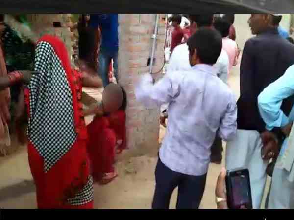 devrani and her lover beaten badly with sticks by the people devrani and her lover beaten badly with sticks by the people