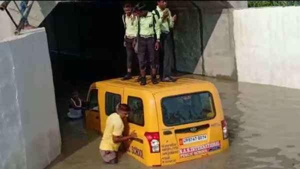 A school van carrying 8 children got stuck in a waterlogged underpass A school van carrying 8 children got stuck in a waterlogged underpass