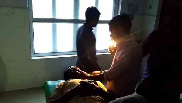doctors treating patients with the torchlight as no electricity in hospital doctors treating patients with the torchlight as no electricity in hospital