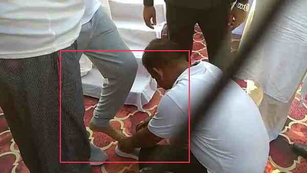 minister laxmi narayan chaudhary shoes tied by a government employee minister laxmi narayan chaudhary shoes tied by a government employee