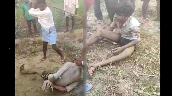 video, villagers cruelly beating a man for buffalo theft video, villagers cruelly beating a man for buffalo theft