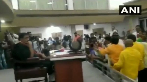 ruckus ensued at Vijayawada after portraits of Chandrababu Naidu were replaced with Jagan Reddy ruckus ensued at Vijayawada after portraits of Chandrababu Naidu were replaced with Jagan Reddy