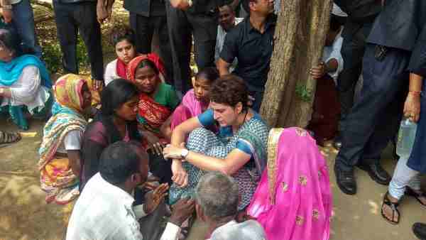 pictures of Priyanka Gandhi weeping during Sonbhadra victims family meeting pictures of Priyanka Gandhi weeping during Sonbhadra victims family meeting
