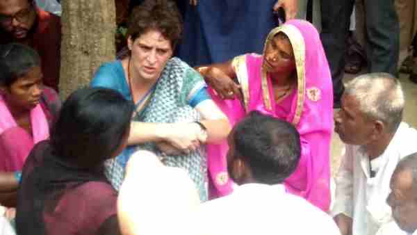 pictures of Priyanka Gandhi weeping during Sonbhadra victims family meeting pictures of Priyanka Gandhi weeping during Sonbhadra victims family meeting