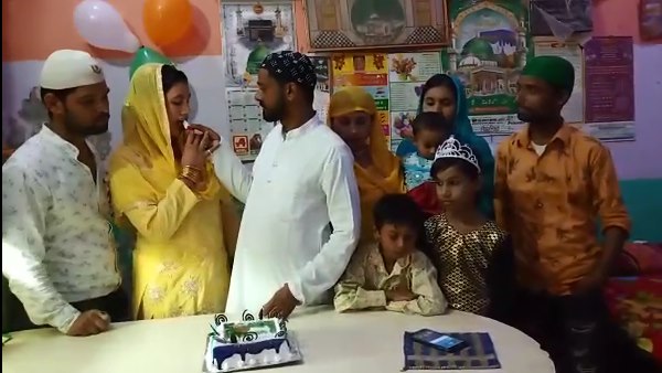 This muslim family celebrate eco friendly bakrid by cutting cakes This muslim family celebrate eco friendly bakrid by cutting cakes