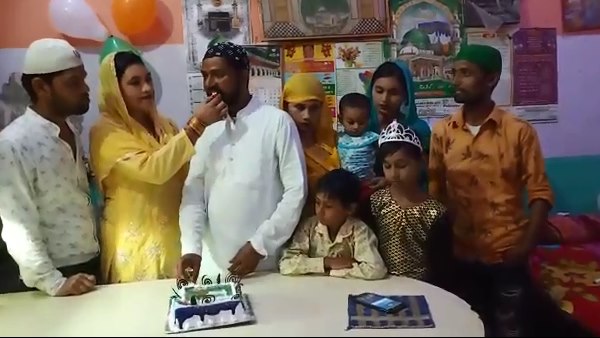 This muslim family celebrate eco friendly bakrid by cutting cakes This muslim family celebrate eco friendly bakrid by cutting cakes