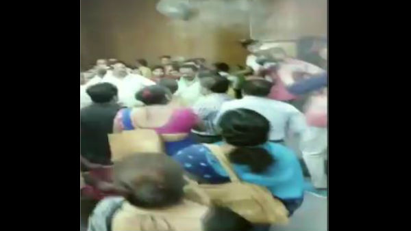 A woman thrashes a govt official with a slipper as over alleged wrongful allocations of houses under Pradhan Mantri Awas Yojana A woman thrashes a govt official with a slipper as over alleged wrongful allocations of houses under Pradhan Mantri Awas Yojana