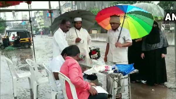 voting in candle light and rain in maharashtra voting in candle light and rain in maharashtra