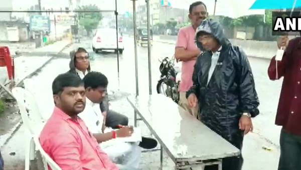 voting in candle light and rain in maharashtra voting in candle light and rain in maharashtra